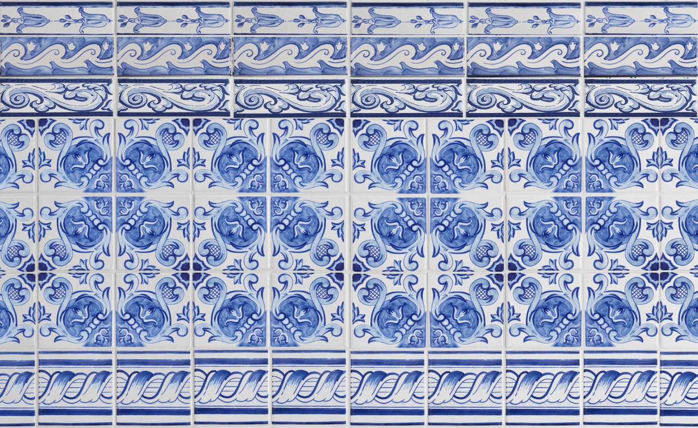 blue and white delft tiles with decorative designs.