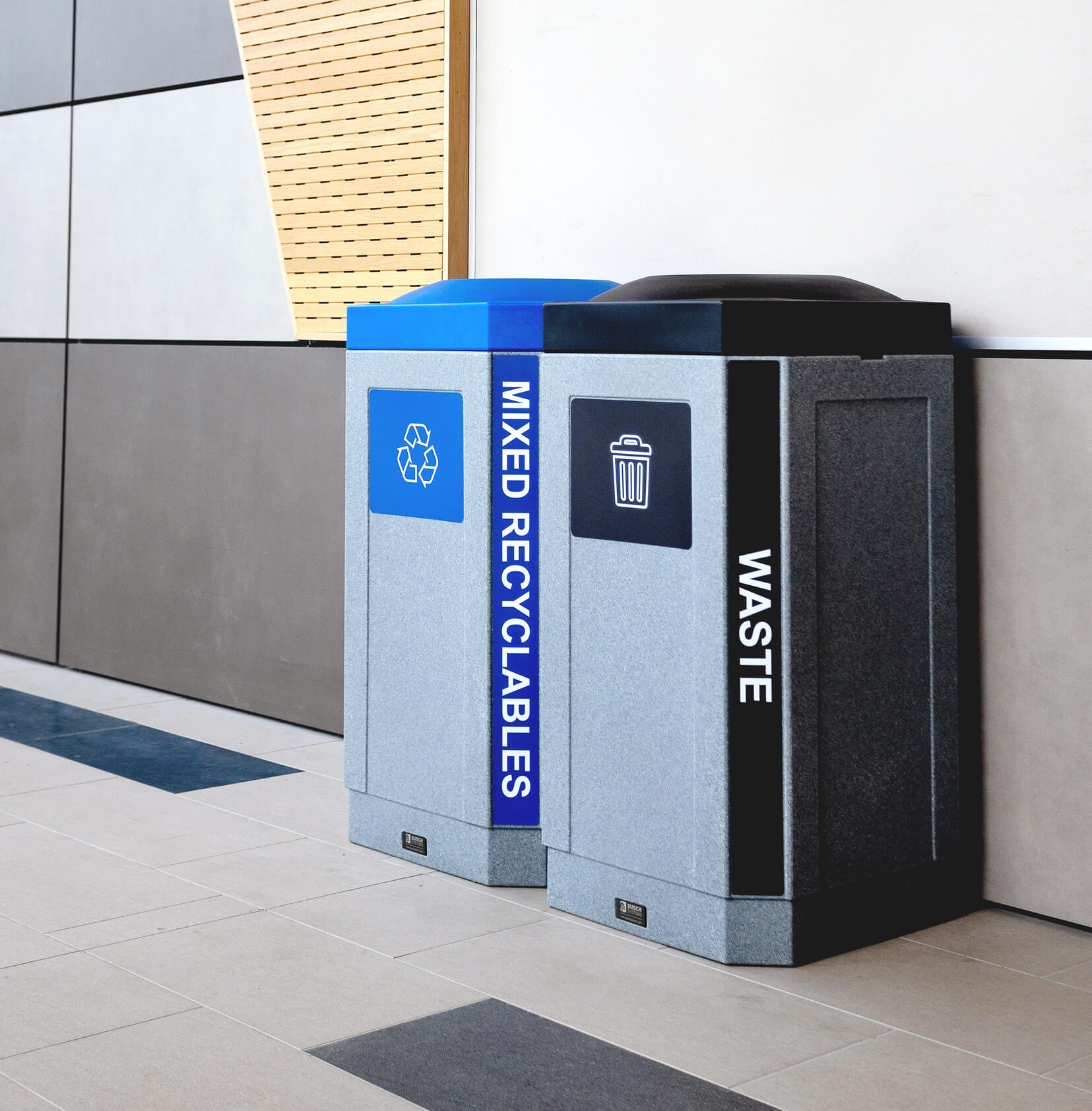 mixed recycling and trash bins with color matching lids for improved diversion in a modern college campus