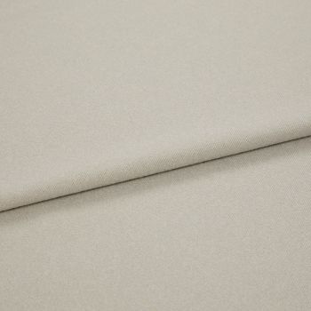 Beige woven fabric folded diagonally, overlapping to form a soft seam; close-up view with even, neutral lighting highlighting fine twill texture.