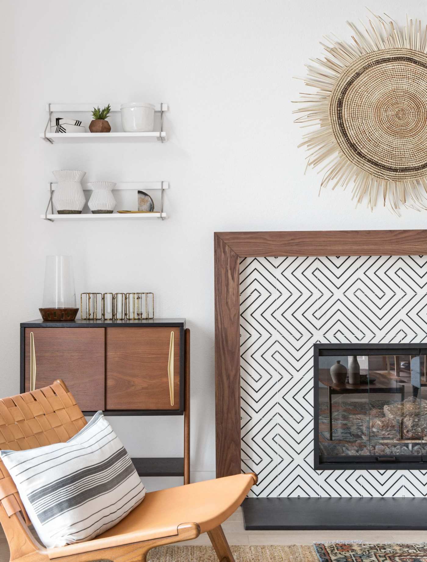 a living room with a fireplace and a chair.