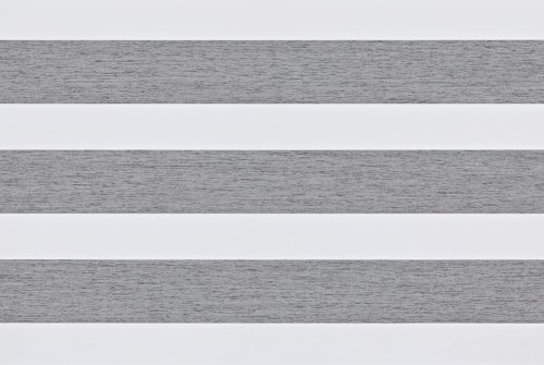Zebra roller blinds with alternating white and textured grey horizontal fabric bands (object); aligned as even stripes filtering soft daylight (action); mounted against a plain interior wall with no visible view (context).