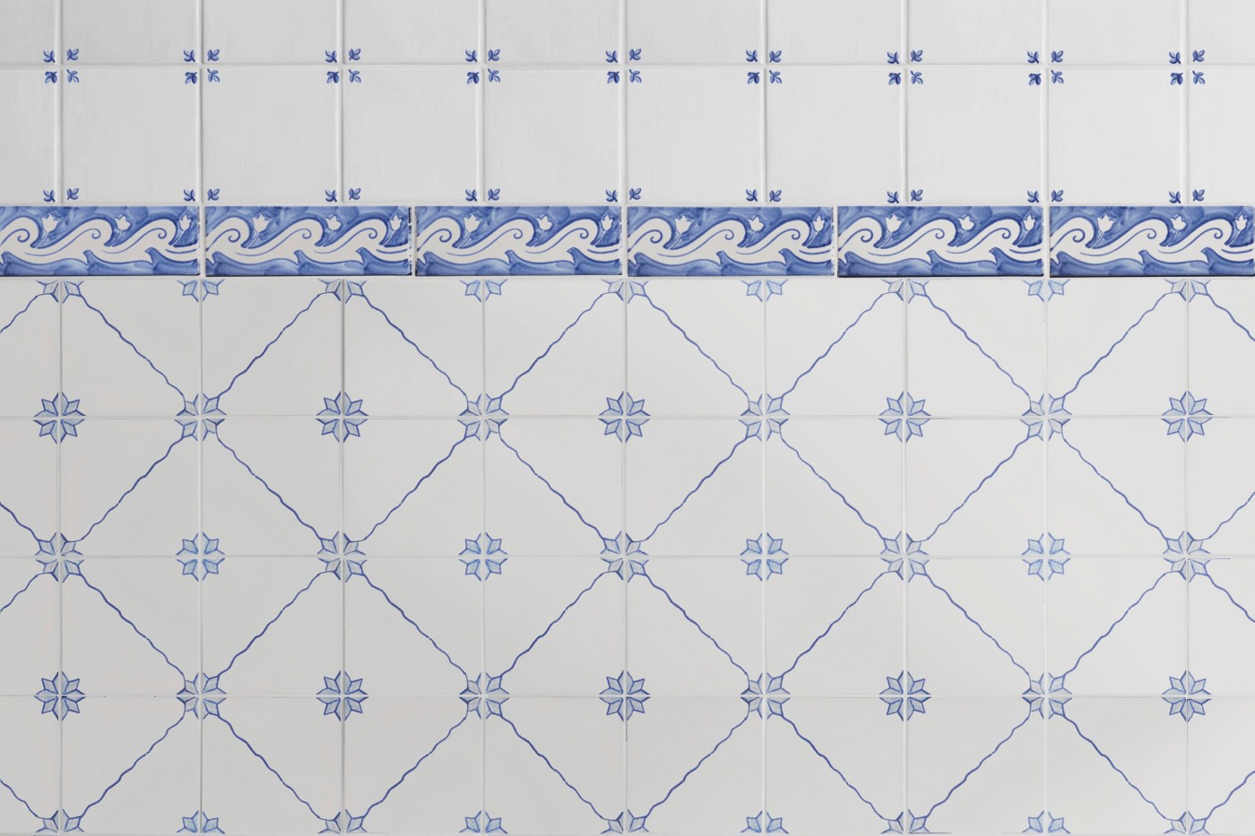 blue and white tile with designs on them.