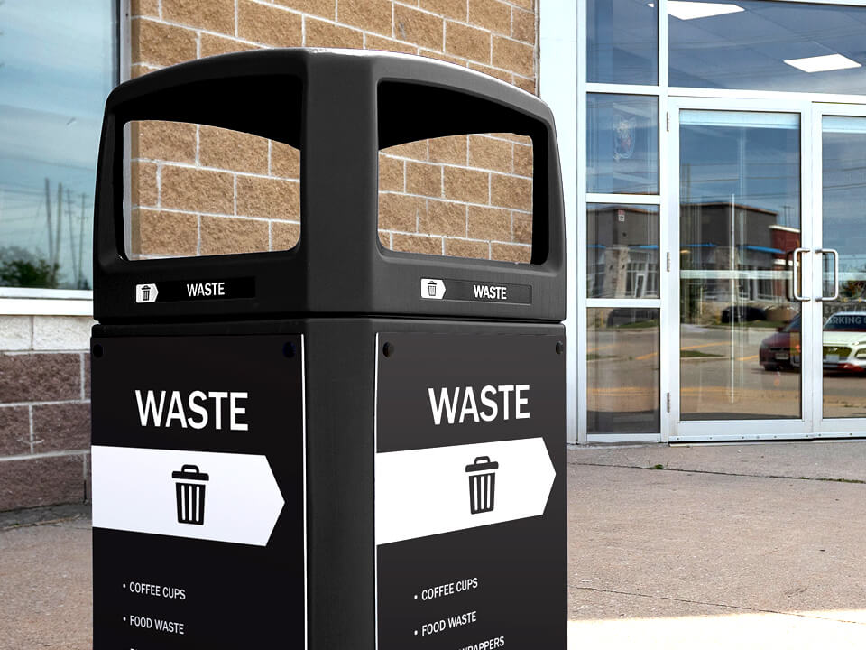 black trash container with a canopy lid outside of a hockey arena