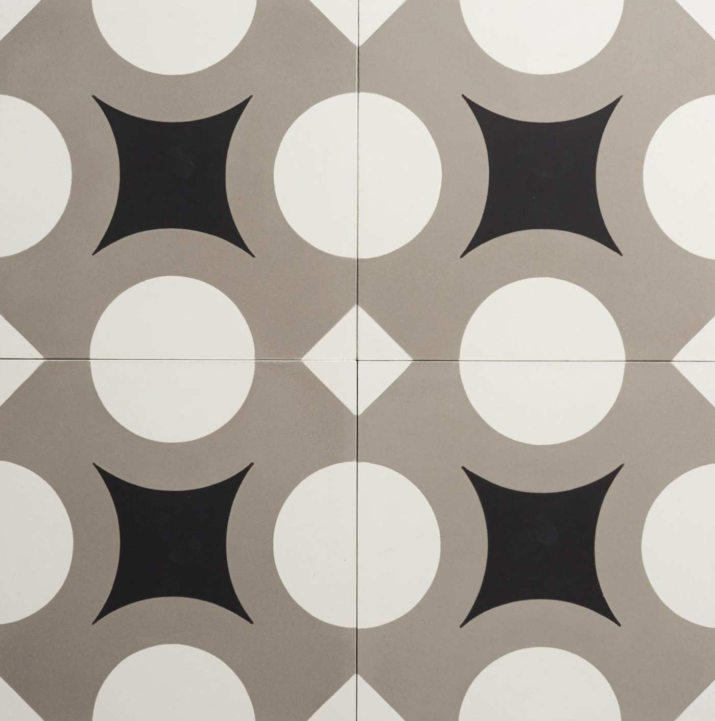 four tiles with black, grey and white designs on them.