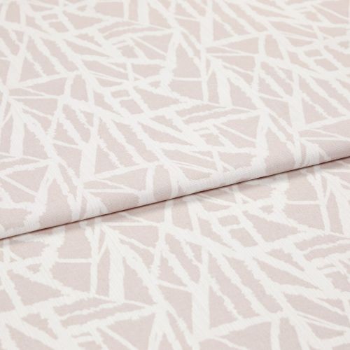 Pale pink woven fabric with white abstract angular lines (object), folded over itself (action), shown in a studio-lit close-up highlighting the textileâ€™s texture and overlapping layer (context).