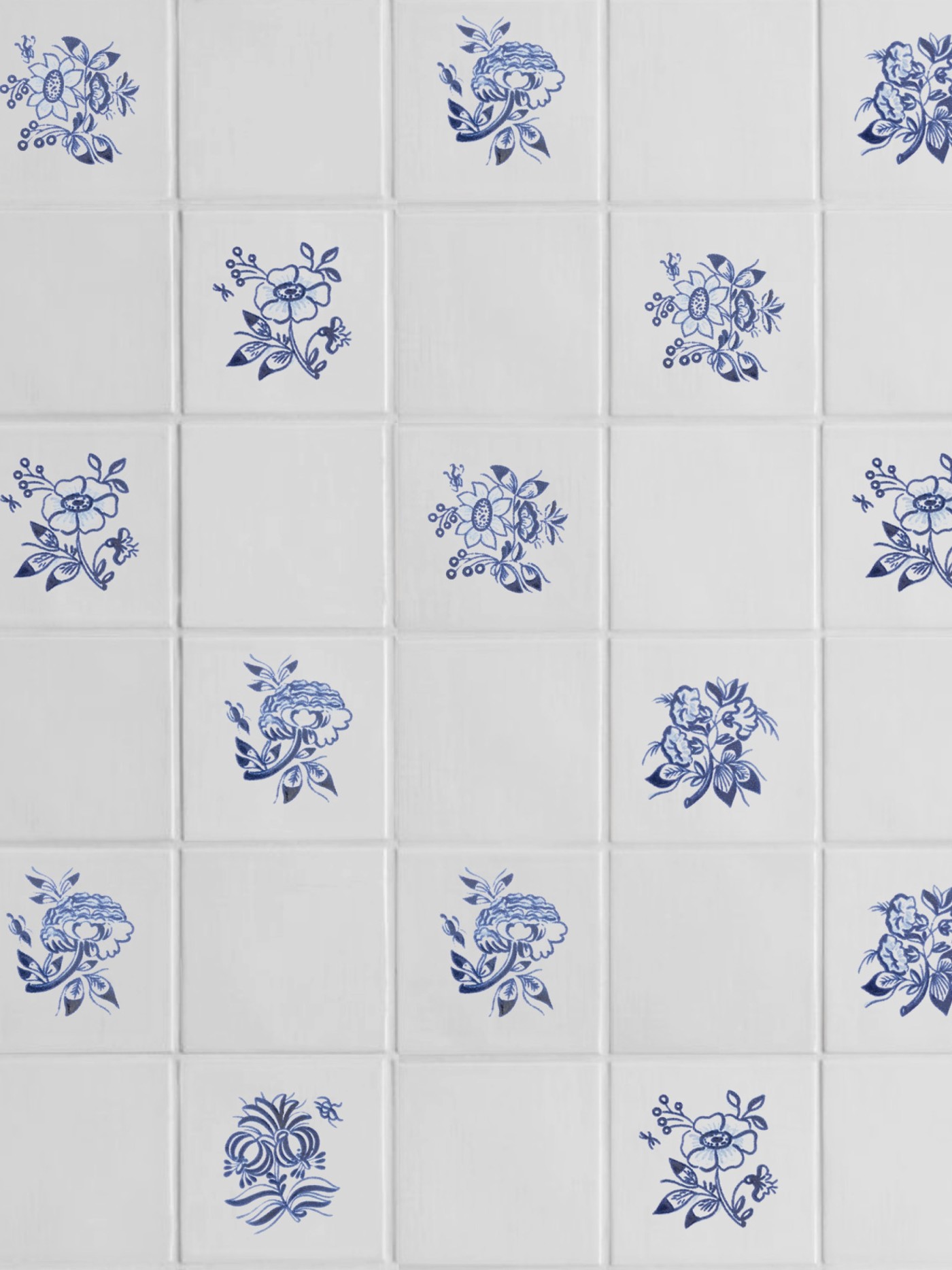 white tiles with hand painted blue floral designs.