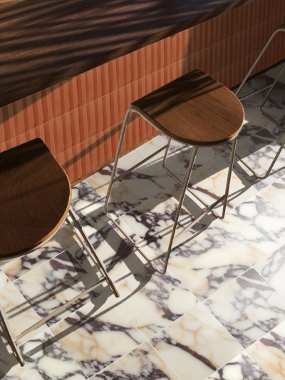three stools are sitting on a marble floor.