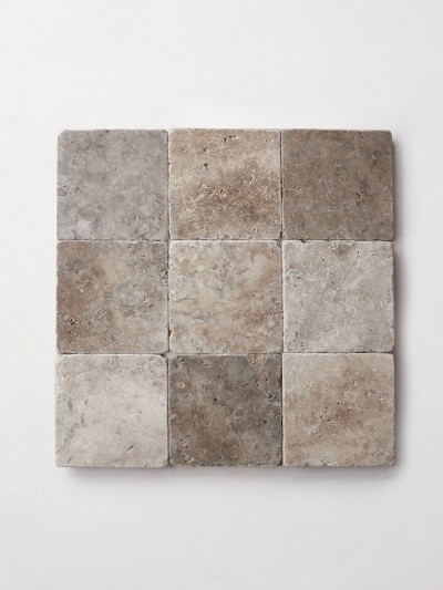 a square tile made of gray and brown stones.