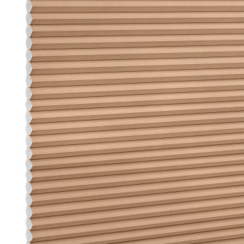 Beige honeycomb (cellular) blind with visible white cell ends at left, closed and blocking light; close-up product shot against a plain white background with even lighting.