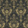 Ornate gold damask motifsâ€”stylized leaves and scrolling flourishesâ€”repeat symmetrically, adorning a flat, distressed charcoal wall surface, suggesting vintage, formal wallpaper in a dimly lit interior.
