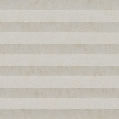 Beige pleated cellular shade, fully lowered with alternating horizontal bands and subtle texture; closed, softly diffusing daylight across a neutral interior wall.
