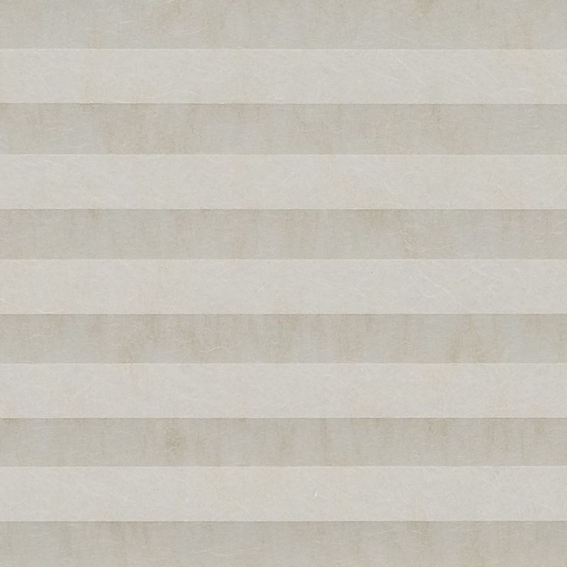 Beige pleated cellular shade, fully lowered with alternating horizontal bands and subtle texture; closed, softly diffusing daylight across a neutral interior wall.