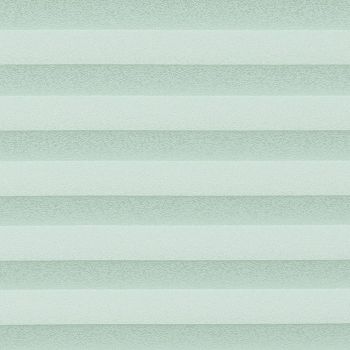 Horizontal cellular shades fill the frame, with alternating opaque and semi-sheer pale mint bands; they filter soft, diffuse light, suggesting a minimally furnished, evenly lit interior.