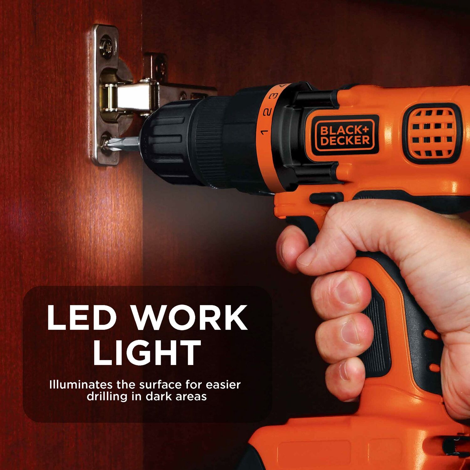Person using a Black and Decker 20 volt max lithium ion cordless drill/driver with LED work light to drive a screw into a cabinet door