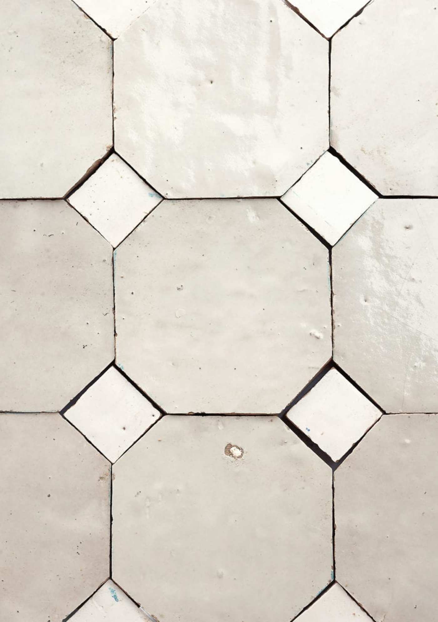 grey and white tiles arranged in a pattern.