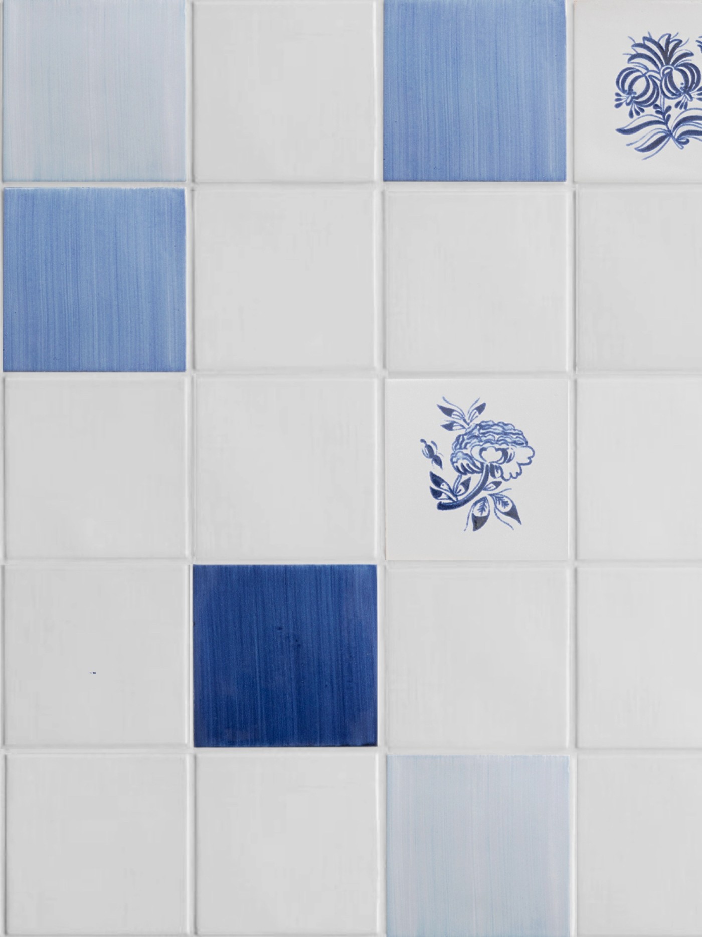 blue and white tiles with several flower designs.