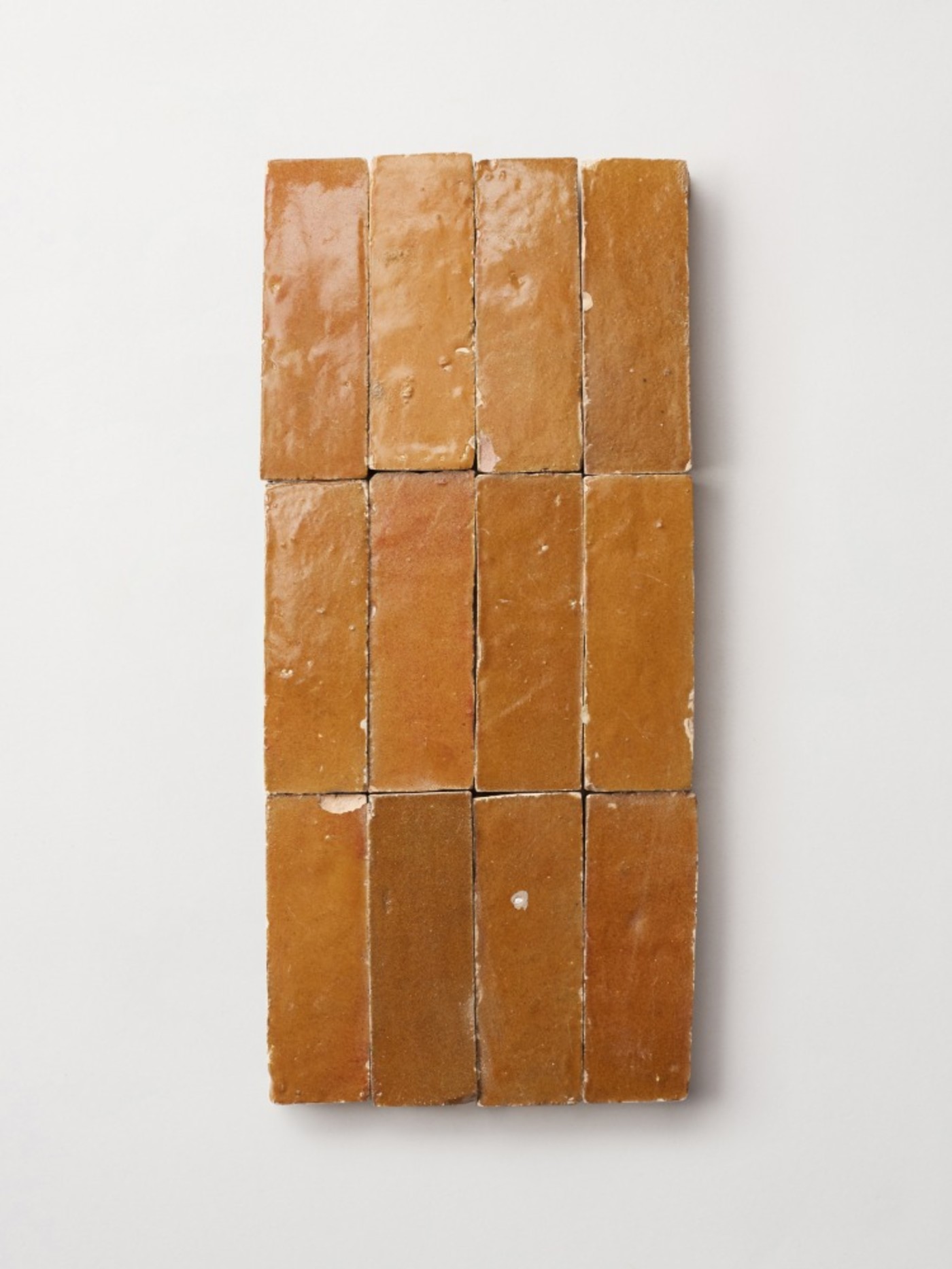 pieces of tan tile on a white background.