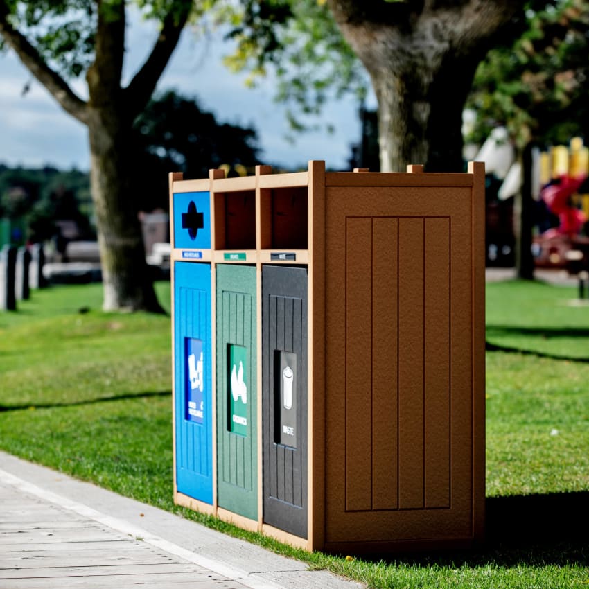 triple waste and recycling container at a local playground