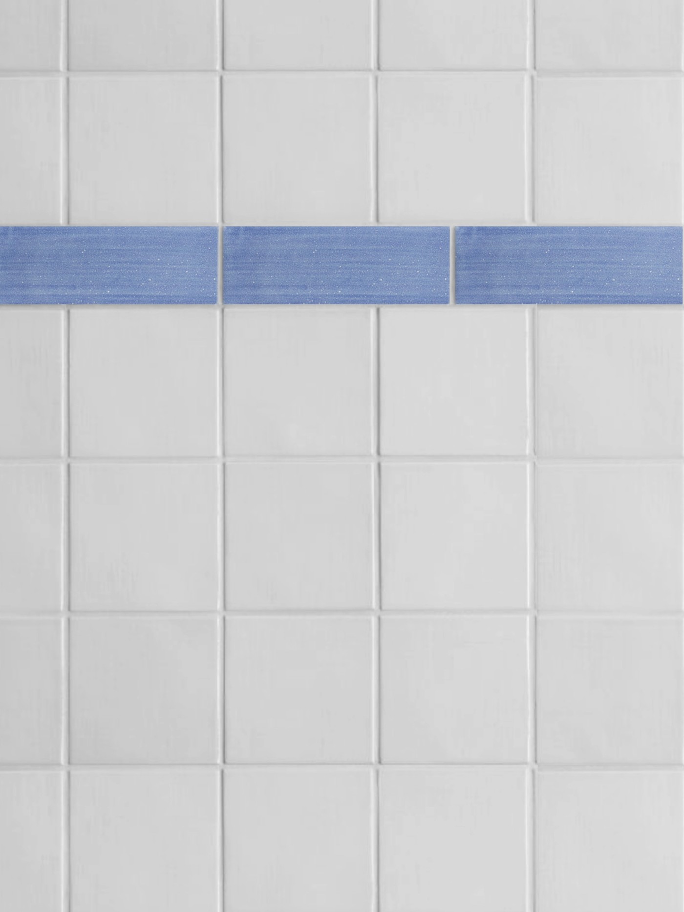 a white and blue tiled bathroom with a blue stripe.