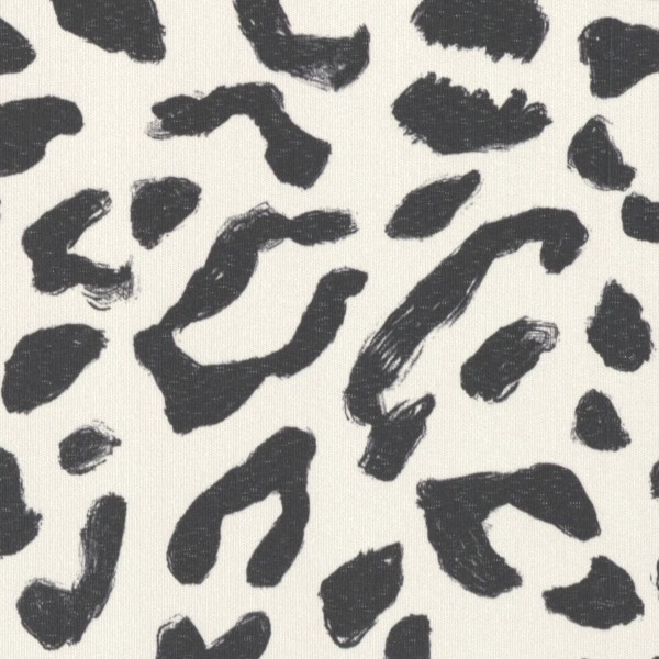 Irregular black brushstroke spots scatter across an off-white, textured fabric background, forming a loose, abstract leopard-print pattern with visible brush marks and varying spot sizes.