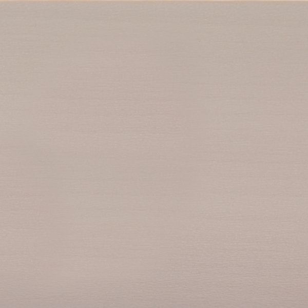 Pale blush-beige textured wallpaper filling the frame, subtly ribbed horizontal grain; evenly lit, neutral-toned surface suggesting an interior wall or backdrop under soft, diffuse lighting.