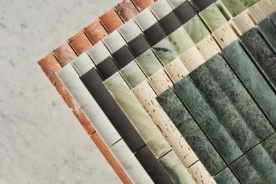 a stack of marble tiles on a marble countertop.