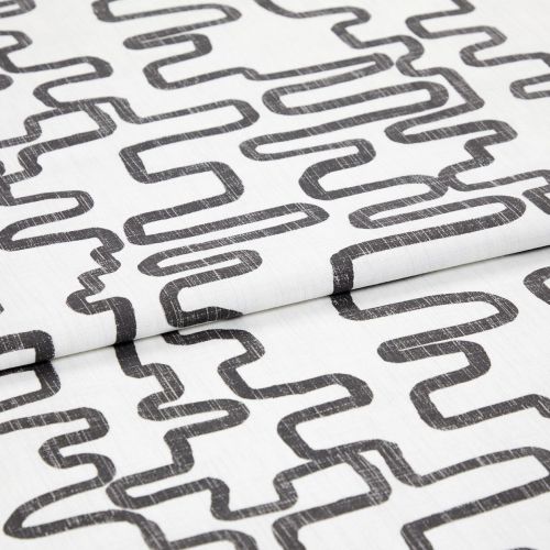 White woven fabric printed with charcoal, distressed looping-rectangle pattern, folded to show overlapping layers; studio close-up with even soft lighting and neutral background.