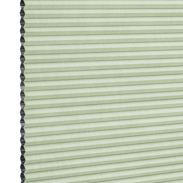 Cellular (honeycomb) blind, pale green with visible black cell edges — closed, pleated and covering the frame — close-up product view with even lighting and a neutral background.