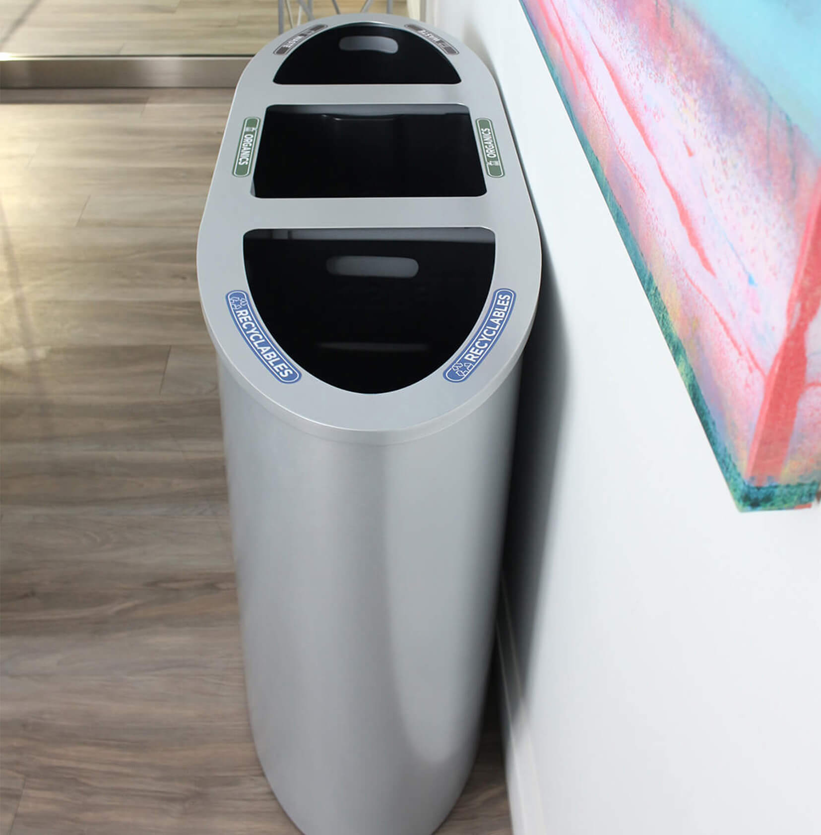 triple stream metal waste and recycling bin with hinged lid and durable plastic liners in a modern corporate office