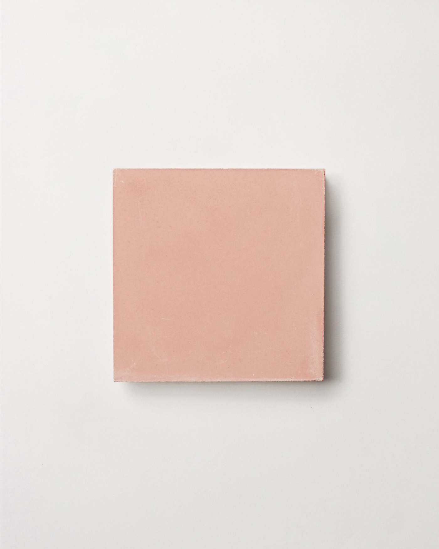 a pink square on a white background.