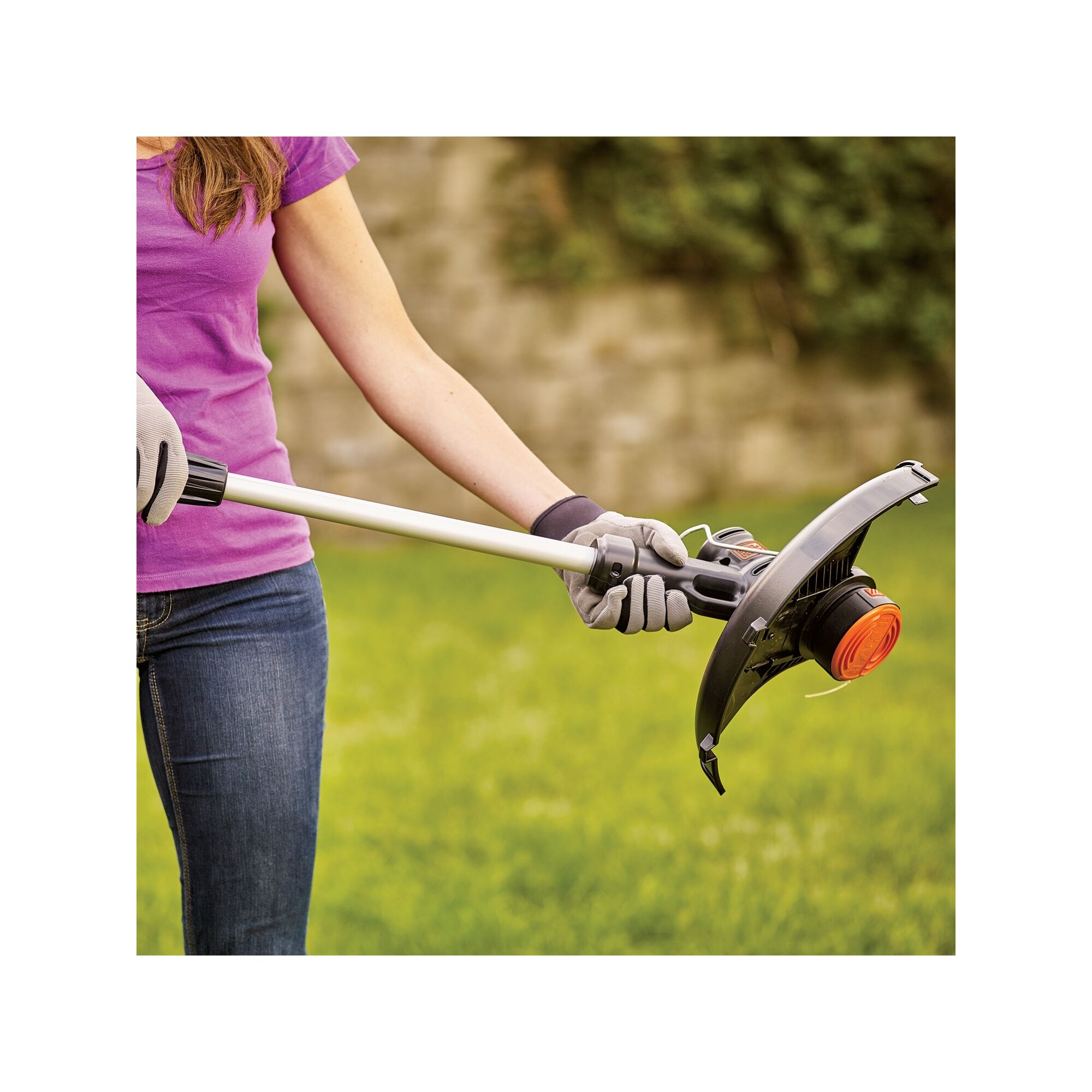 Woman holding string trimmer