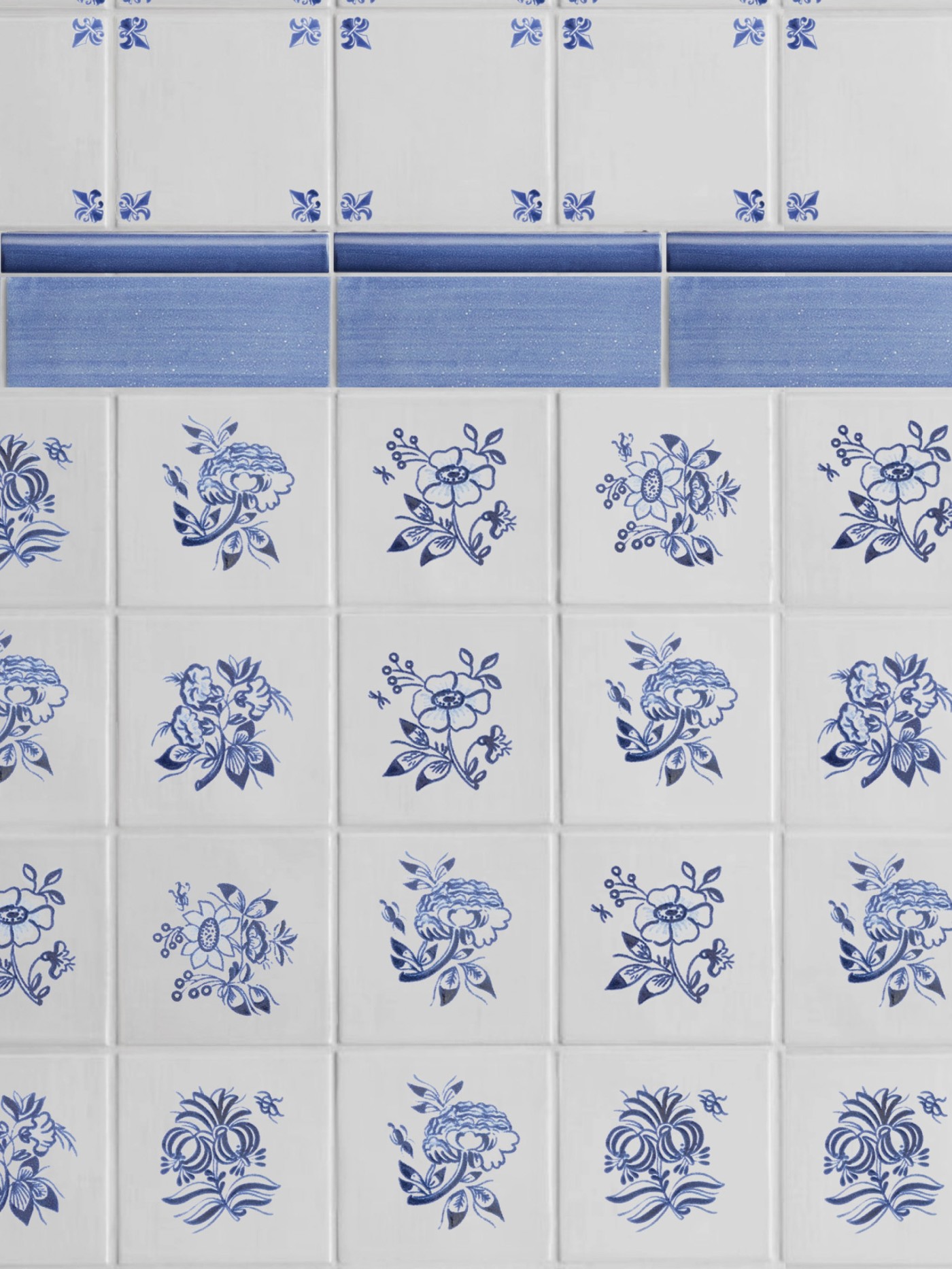 a blue and white tiled wall with floral designs.