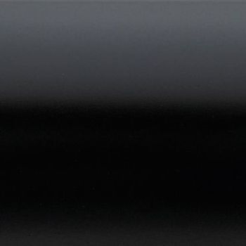 Glossy black panel with subtle horizontal bands, showing a smooth gradient from dark gray at top to deep black lower down; reflecting faint, diffuse light in a low-light, minimal setting.