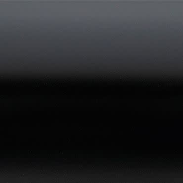 Glossy black panel with subtle horizontal bands, showing a smooth gradient from dark gray at top to deep black lower down; reflecting faint, diffuse light in a low-light, minimal setting.