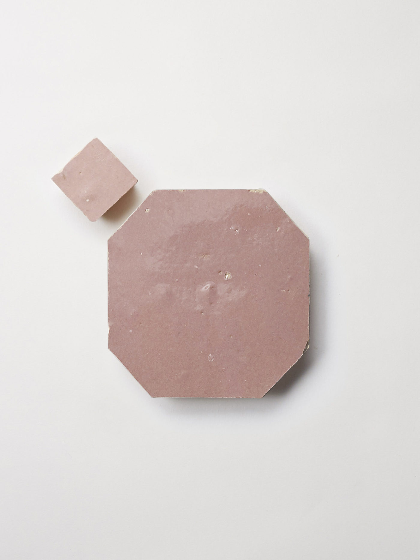 pink tiles on a white surface.