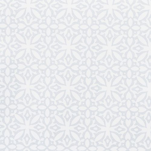 Pale gray-blue stenciled wallpaper with a repeating floral-medallion motif covers the entire surface, creating a subtle textured pattern; interior wall, evenly lit with soft, diffused daylight.