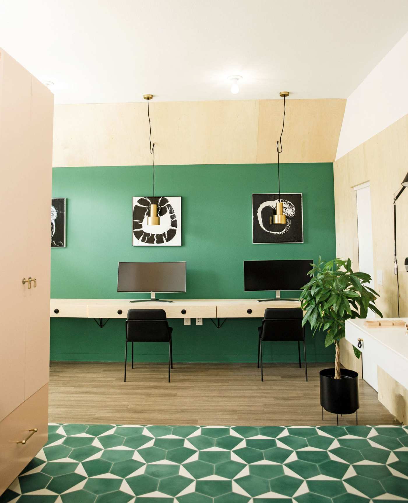 an office with green walls and a green floor.