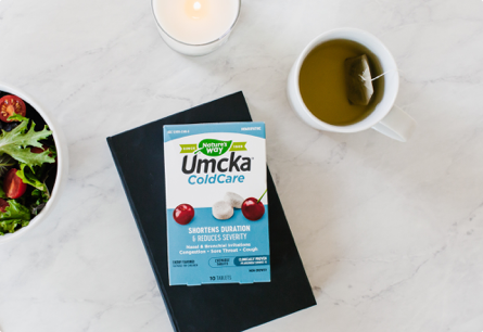 A package of Umcka ColdCare chewables laying on a table.