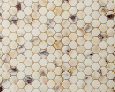 a close up image of a white and brown mosaic tile.