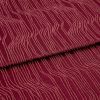 Burgundy fabric with raised, irregular pale-pink wavy lines (textured pile), folded once across the center, lying flat in a close-up, evenly lit studio view, showing pattern and subtle shadows.