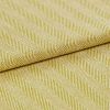 Yellow-green woven fabric with diagonal ribbed herringbone pattern; folded over itself, revealing layered texture; close-up studio-lit view emphasizing the weave and pattern across a flat surface.