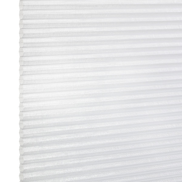 White pleated cellular window blind with visible left edge and horizontal folds, closed and diffusing daylight; close-up view against a bright, neutral background.