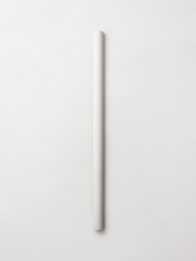 a white tube sitting on a white surface.