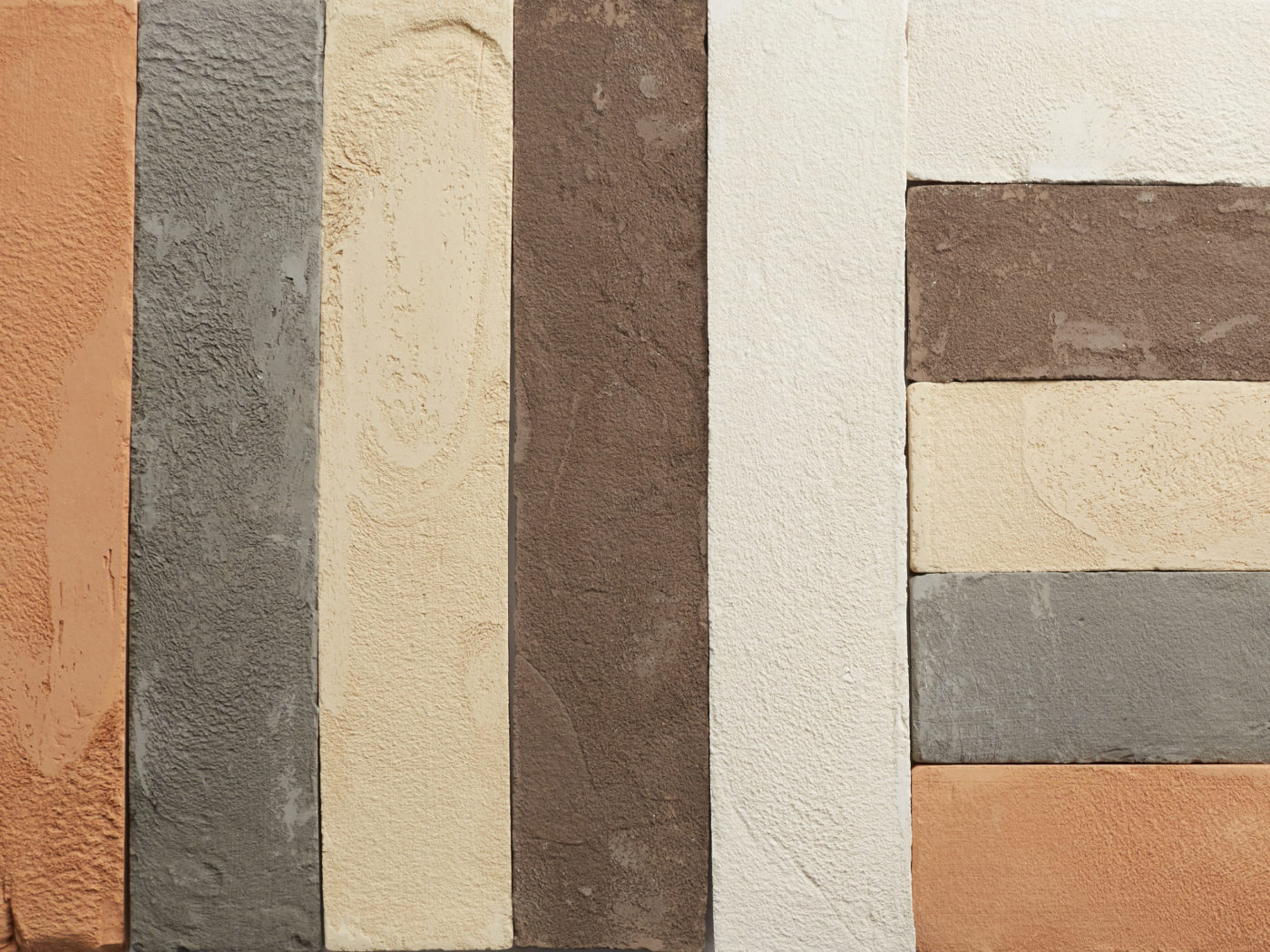 a close up of a row of different colored tiles.