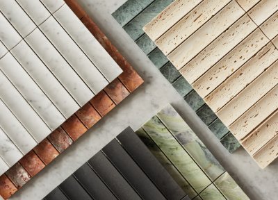 a variety of different colored tiles are laid out on a table.