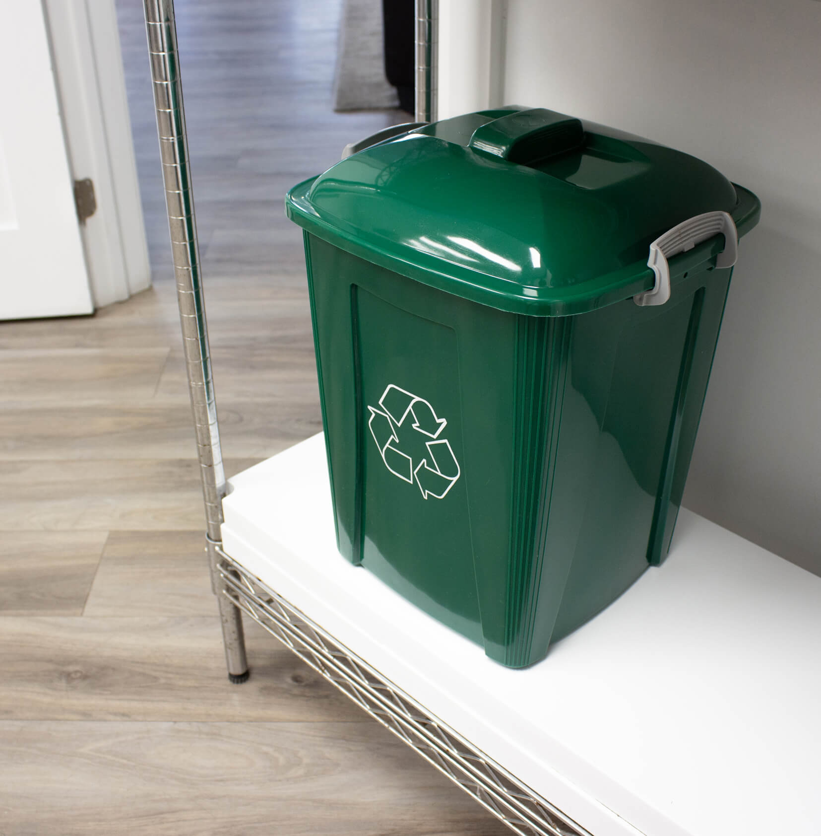 durable plastic recycling bin made from green HDPE sitting on a lunch room shelf