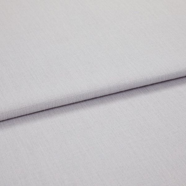 Light grey woven fabric panels overlapping in a folded horizontal seam, showing fine texture and tight weave; close-up, soft even lighting on a neutral surface.