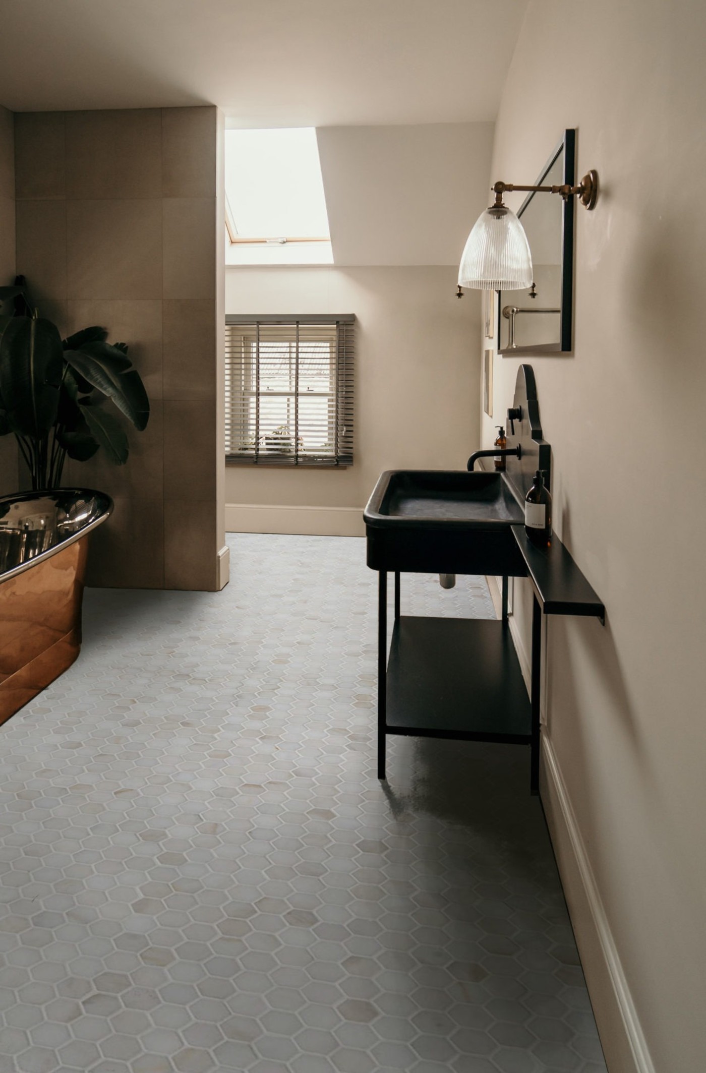 a bathroom with a bathtub and a sink.