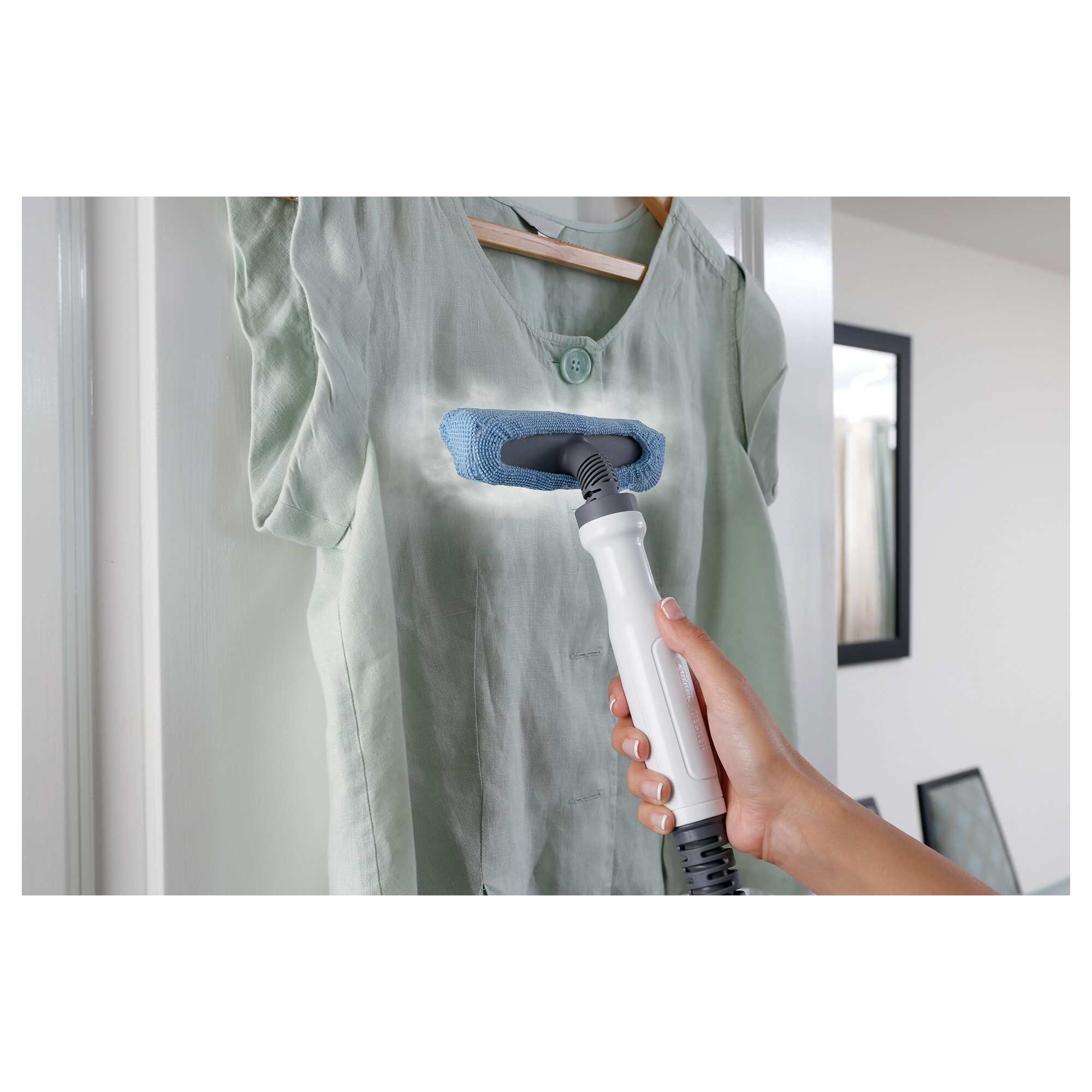 Dustbuster advanced clean cordless hand vacuum being used to clean the crease of a couch.