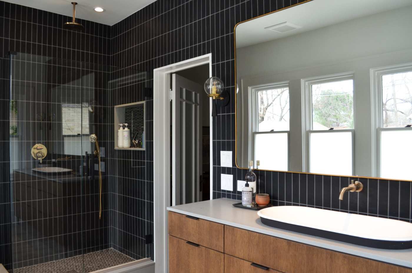 a black tiled bathroom.